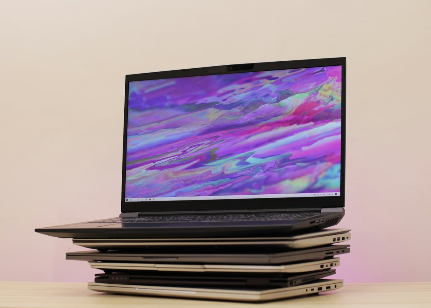 Stack of used laptops evaluated for resale